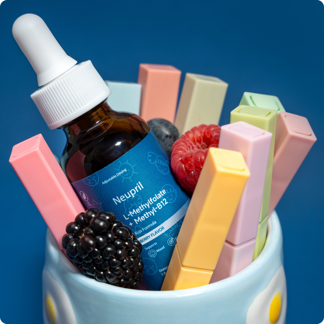 Neupril in a container surrounded by berries and markers